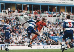 Steve Davis heads at goal