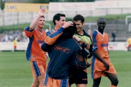 Kelvin Davis celebrates the win with his teammates