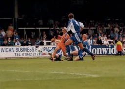 Sean Evers can't be stopped by the Wigan defence as he scores the Towns second