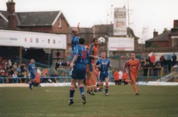 Phil Gray jumps for a header