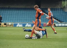 Stuart Fraser moves forward with Chris Willmott watching on