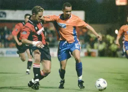 Liam George outmuscles the Cherries defender