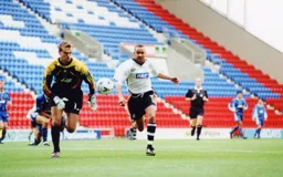Liam George in a race with the keeper