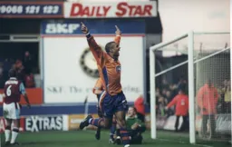 Neil Midgley celebrates his first double for the Town to clinch a 2-1 win over the Clarets