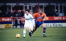 Jon Macken shields the ball from Alan White as the Town with the youngest side in the division lose out