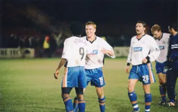 Matty Taylor congratulates the goalscorer and match winner Stuart Douglas