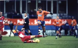 Liam George hurdles the challenge as in the spirit of Christmas the Town share the Boxing Day points