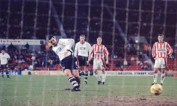 Matty Spring calmly slots our penalty home. Alan White watches on