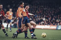 Liam George outmuscled on a day when it took a defender Emmerson Boyce to score for the Town