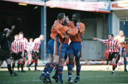 Phil Gray celebrates his first with Marvin and Matty, much to the disgust of the Stoke player