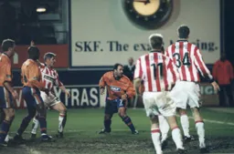 Phil Gray in the act of scoring his second with Stoke defenders complaining again