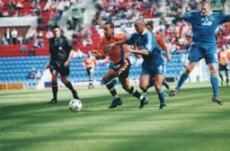 Liam George gets away from his marker whilst future Hatter Kevin Nicholls apears to be doing a star jump