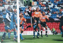 Roy Carroll snatches the ball off the head of Liam George