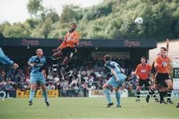 A looping header by Tresor Kandol scores Town`s equalizer