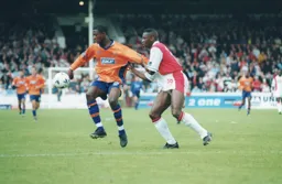 Tresor Kandol has his shirt grabbed by Brian Wilsterman