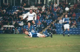 Liam George hurdles a fallen Peterborough defender
