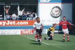 Mark Stein turns away after scoring the first goal. Future Hatter Sol Davis appeals for offside