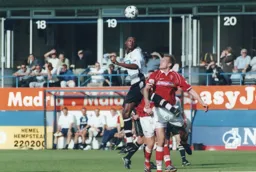 Tresor Kandol gets airbourne to win a header