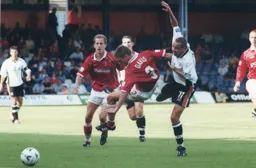 Sol Davis gets off the ground as Liam George appl;ies the pressure