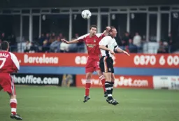 Paul McLaren and Darren Ferguson look to win a heading duel