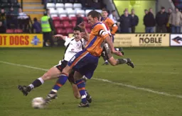 Paul McLaren is about to be tackled