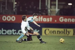 Adam Locke at full stretch to win the ball