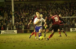 Zigor Aranalde moves in to tackle Petri Helin