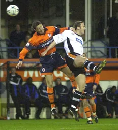 The ball eludes Steve Howard and Adrian Whitbread