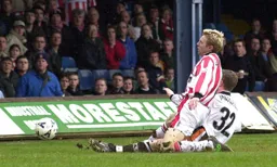 Lee Mansell slides in to score Town`s goal