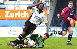 Stuart Douglas dives over Gary Kelly