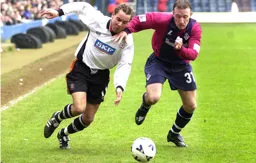 Liam George out wide gets past Tony Carss