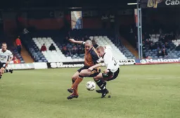 Lee Mansell turns to chase the ball