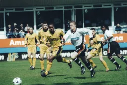 Lee Mansell races after the ball