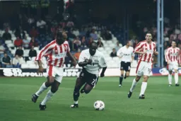 Adrian Forbes moves away with the ball