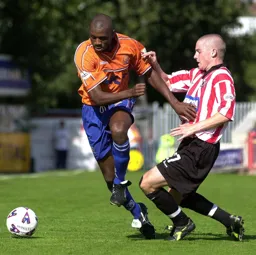 Emmerson Boyce evades a tackle