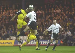 Chris Coyne wins a header