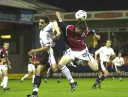 Jean-Louis Valois tangles with a Darlington defender