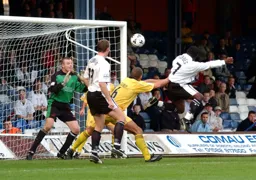 Adrian Forbes heads in the Town's third goal