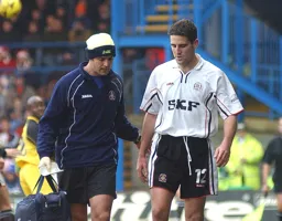 Chris Coyne limps off