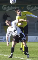 Dean Crowe refuses to be muscled off the ball