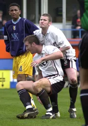 Steve Howard is helped to his feet after putting the Town 4-2 up