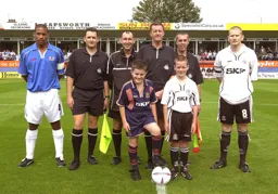 Kevin Nicholls with mascot vs Peterborough