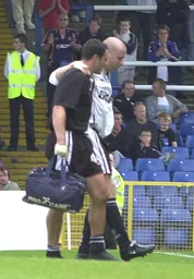 Paul Hughes receiving trreatment from the physio