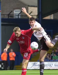 Russ Perrett challenging for the ball