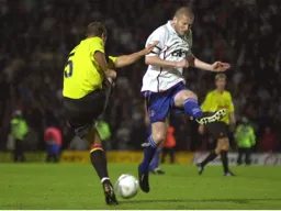 Kevin Nicholls goes in for a strong tackle