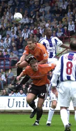 Andrew Fotiadis using Steve Howard to jump for the ball