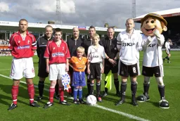 Kevin Nicholls with mascot vs Swindon