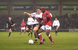 Steve Howard battles for the ball