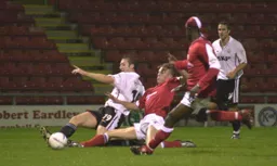 Steve Howard slides in for the tackle