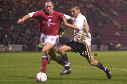 Sol Davies chases the ball